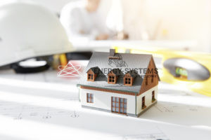 миниатюра дома стоит на проекте