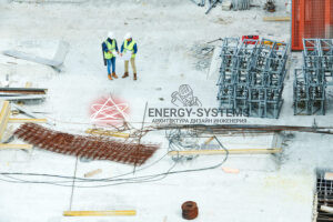 Builders viewing blueprint plan