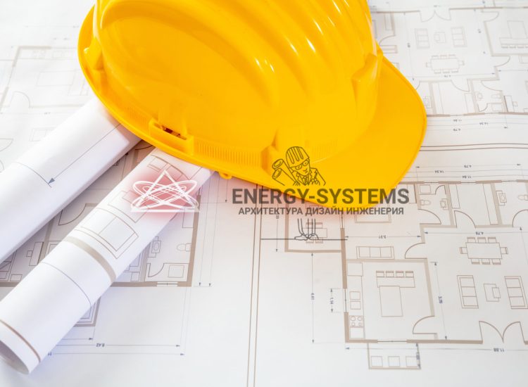 желтая каска лежит на проектной документации