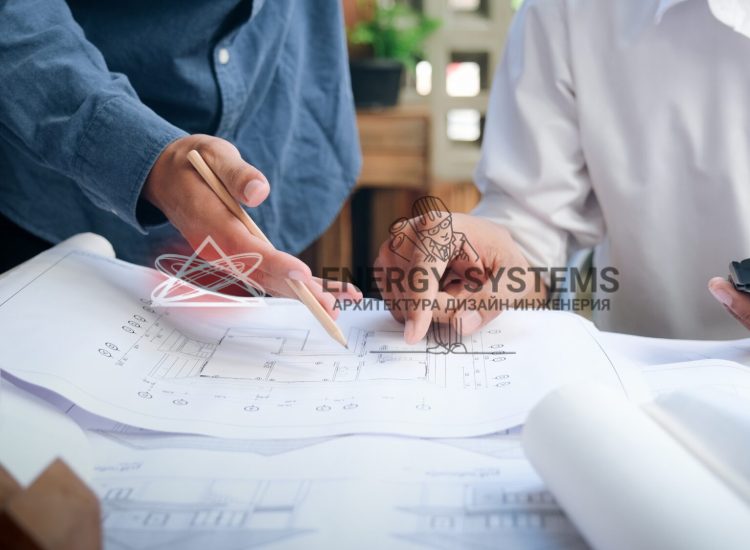 двое людей указывают на деталь в проекта