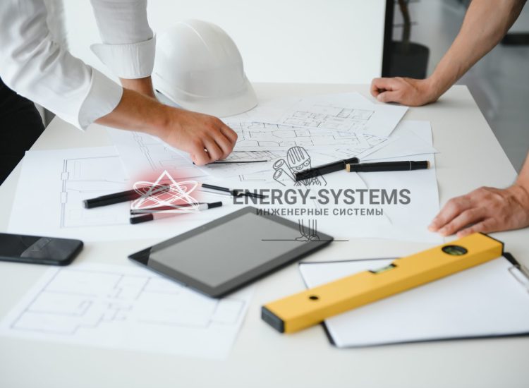 инженеры за столом изучают проект на инженерию