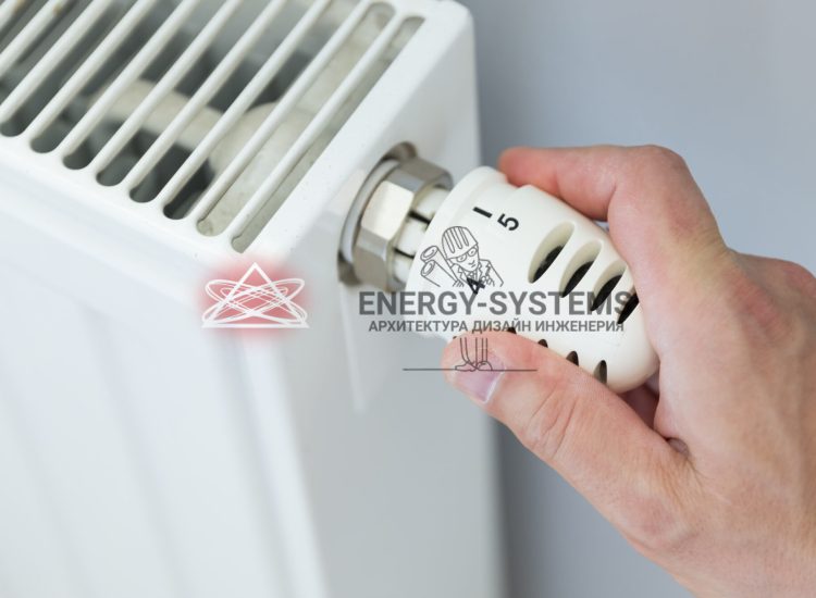 человек крутит регулятор отопления