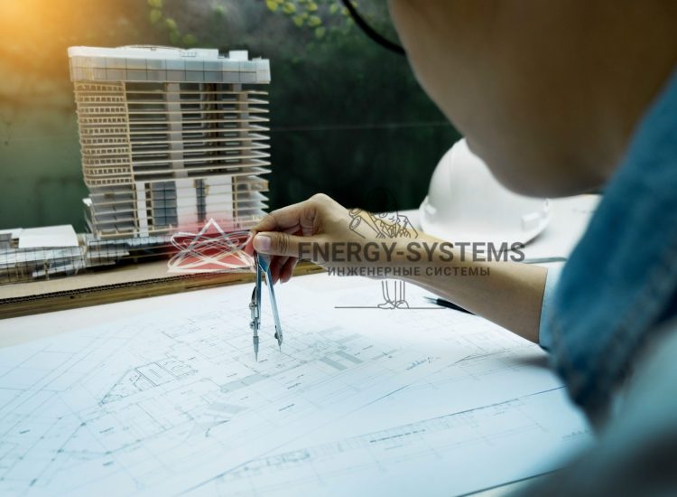 мужчина работает над проектом отопления